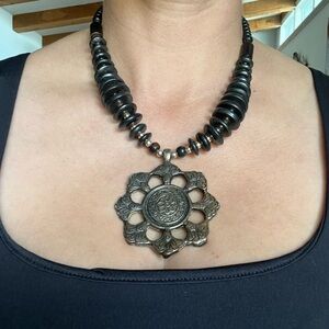 Black India inspired necklace with metal medallion